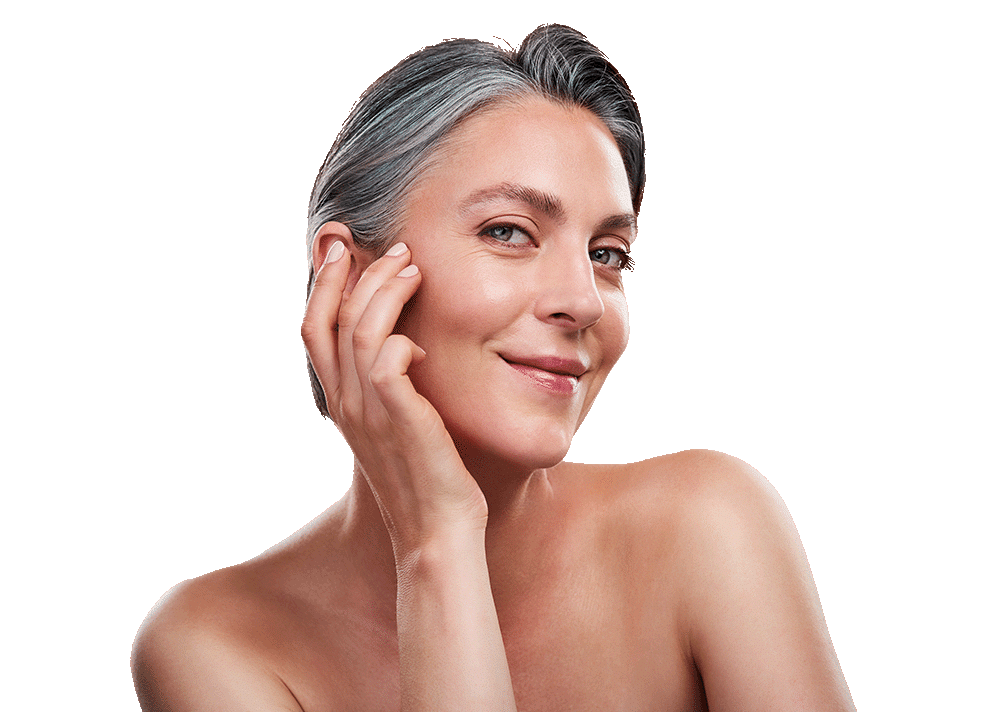 Woman touching her face, like she's just applied skin care.